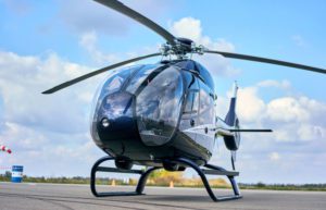 helicopter in runway with pilots